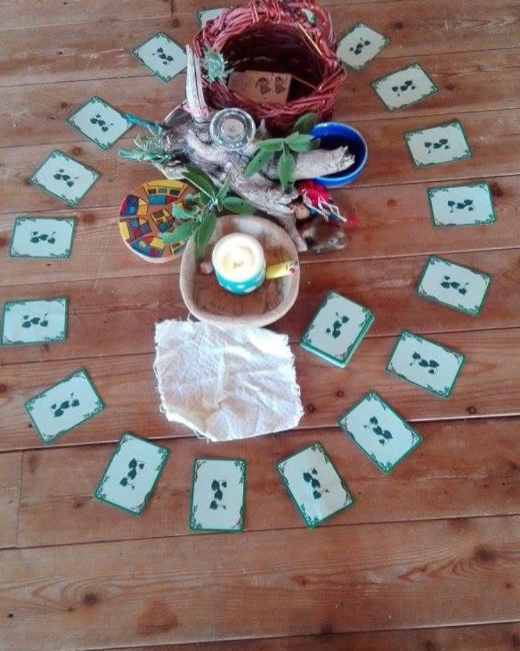 Ritual mandala of cards and natural objects